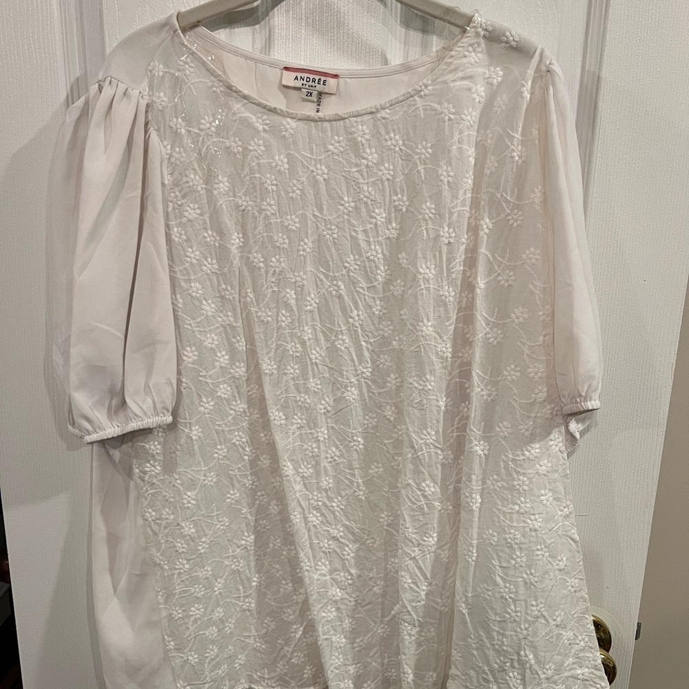 White top with floral detail